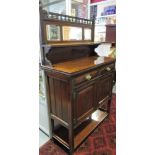 A late Victorian mahogany side cabinet with raised mirror back over 2 frieze drawers,