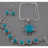 A turquoise necklace, the stones set in white metal.