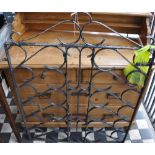A black painted wrought iron garden gate approx. 110 x 84 cms.