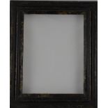 A 19th century tortoiseshell and ebonised picture frame, the aperture 39 x 29cm.