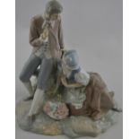 A Lladro figure group, modelled as a gallant and lady with a basket of flowers, H. 29cm.