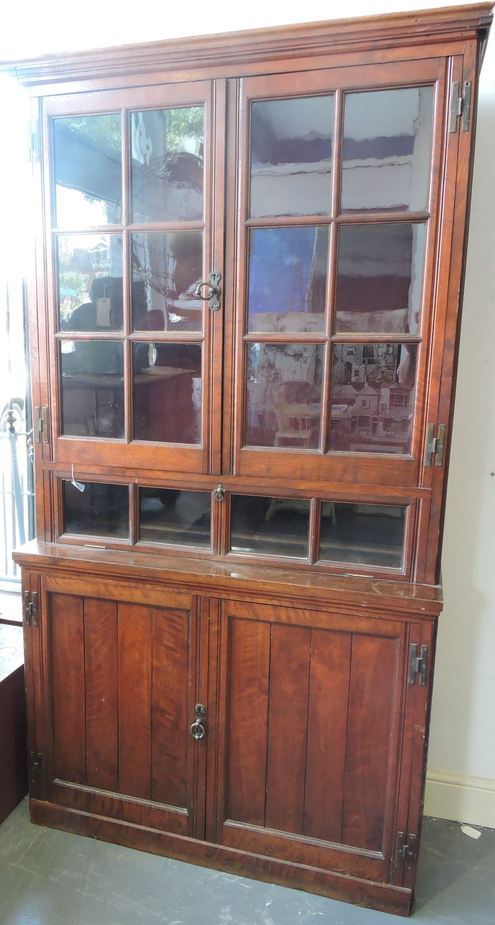 An Edwardian walnut bookcase cabinet,