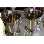 A pair of nickel plated two handled wine coolers with engraved armorial design,