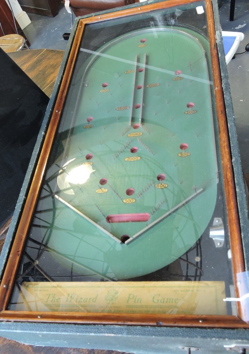 'The Wizard Pin Game' table-top bagatelle board, rectangular with a glass top and green rexine case,