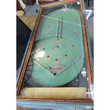 'The Wizard Pin Game' table-top bagatelle board, rectangular with a glass top and green rexine case,