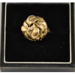 A gold dress ring, of cluster leaf form and marked as 9ct, 5.5g.