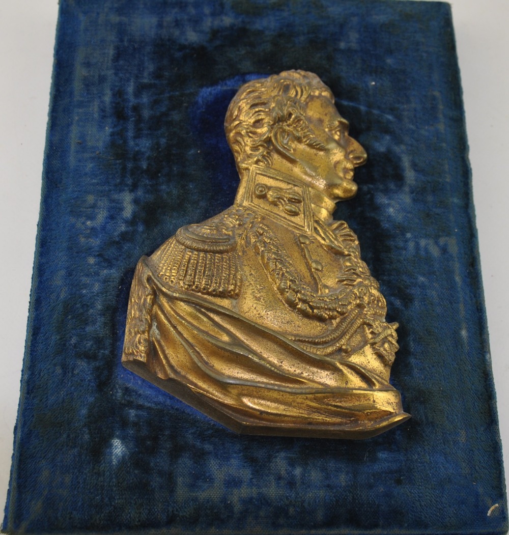 A 19th century gilt bronze bust of Wellington, in profile facing to his left,