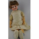 An early 20th century German bisque head doll with sleeping blue eyes,