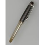 A Mont Blanc silver solitaire fountain pen.