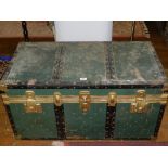 A 20th century brass bound and wooden travelling chest.