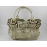 A Burberry Beaton quilted cream patent leather ladies handbag,