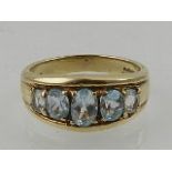 A 9 carat yellow gold and aquamarine ring,