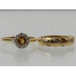 A 9 carat yellow gold, diamond, and citrine cluster ring,