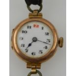 An early 20th century 9 carat yellow gold ladies wristwatch, having leather strap.