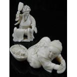 A Japanese carved bone okimono figure of a fisherman, together with a similar figure of a woman.