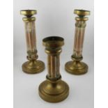 A pair of brass bound and bamboo pricket candlesticks,