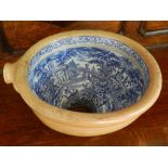 A Victorian Staffordshire blue and white ceramic toilet bowl, decorated with landscape scenes.