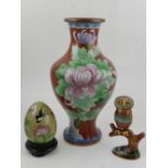 A 20th century Chinese cloisonne baluster vase, together with a cloisonne owl,