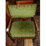 A pair of 19th century mahogany armchairs, having barley twist arms, legs, and stretchers,