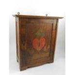 WITHDRAWN - A Scandinavian stained beechwood wall mounted cupboard,