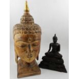 A Thai carved and gilt-heightened hardwood study of the head of Buddha,