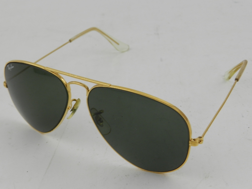 A pair of 1985 Ray Ban Pilot sun glasses