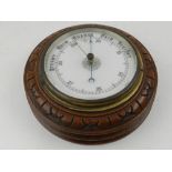 A 20th century circular oak barometer.