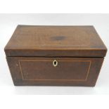 An Edwardian mahogany tea caddy, boxwood line inlaid, with ivory escutcheon (lacking key),