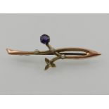 A 9 carat yellow gold, amethyst, and split seed pearl bar brooch.