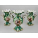 A set of three 18th century style twin handled urns, having vignettes and flowers,