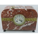 An early 20th century Continental red marble and brass mantel clock,