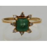A yellow gold, diamond, and Columbian emerald ring,