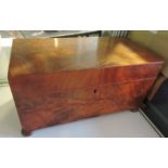 A Victorian figured mahogany rectangular tea caddy on flat bun feet