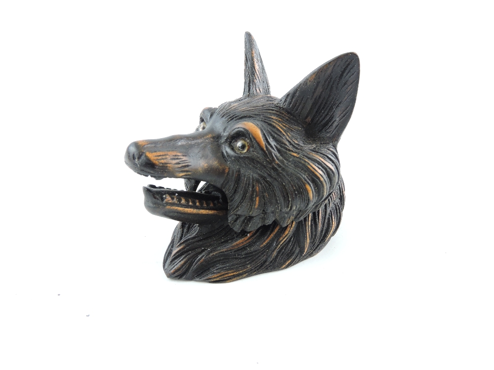 A carved Blackforest style inkwell in the form of a fox head, H. 8cm.