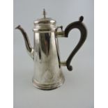 A Georgian style silver coffee pot, London 1980 by C J Vander, 23.