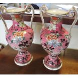 A pair of early 20th Century Japanese Kutani vases decorated with flowering peony,
