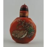 A Peking glass snuff bottle amber coloured with facet cuts and decorated with birds and flowers,