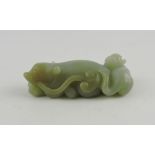 A jade paperweight, modelled in the form of two beasts intertwined, L. 7cm.