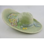 A Beswick wall pocket, modelled as a hat with summer flowers, H. 25cm.