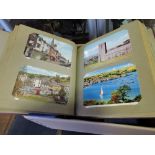 Five postcard albums with many hundreds of postcards,