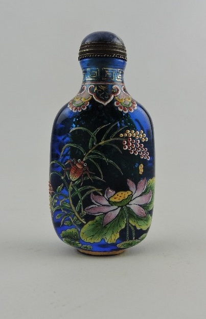 A Peking glass snuff bottle, blue with floral decoration and four character mark to base, H.