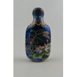 A Peking glass snuff bottle, blue with floral decoration and four character mark to base, H.