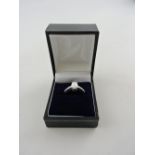 A cubic zirconia and oplite dress ring, set in a white metal band stamped 925, 2..2g.