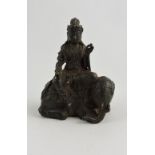 A Chinese cast bronze figure of guylan, seated upon an elephant, H. 8cm.