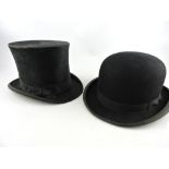 An early 20th century gentleman's black silk top hat, together with a later bowler hat, (2).