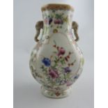 A famille rose flattened baluster shaped vase with elephant handle vase, H. 17cm.