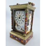 A champleve enamel repeating carriage clock, the side panels decorated with elegant nudes, H. 19cm.