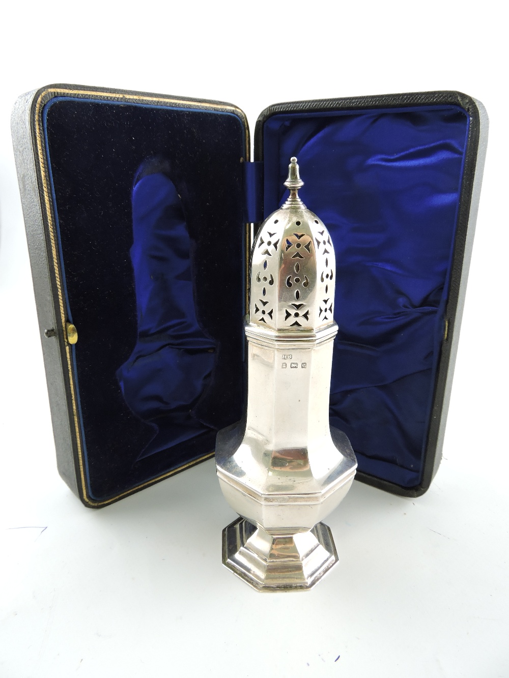 An Edwardian silver sugar caster, Birmingham 1904, by Henry Bourne, of octagonal baluster form,