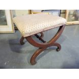 A mid Victorian mahogany X frame dressing stool turned central structure