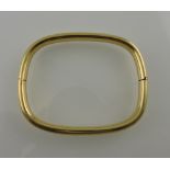 A yellow metal bangle, of hinged rectangular form, stamped 750, 23.7g.